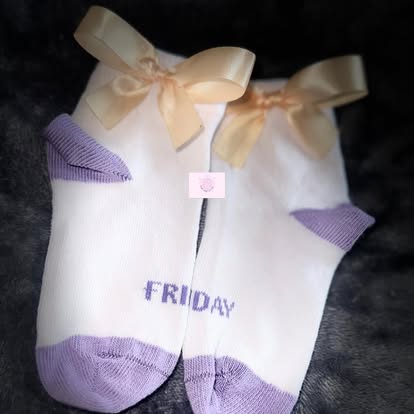 White and lilac socks embroidered with 'FRIDAY' and cream satin bows