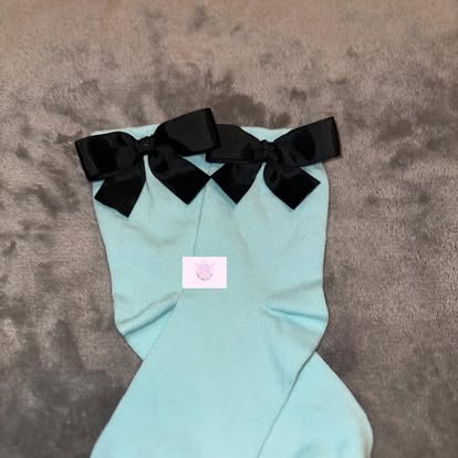 Mint green socks with black grosgrain bows
