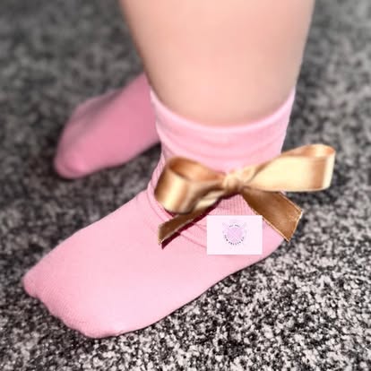 Pink baby socks with gold satin ribbon bows